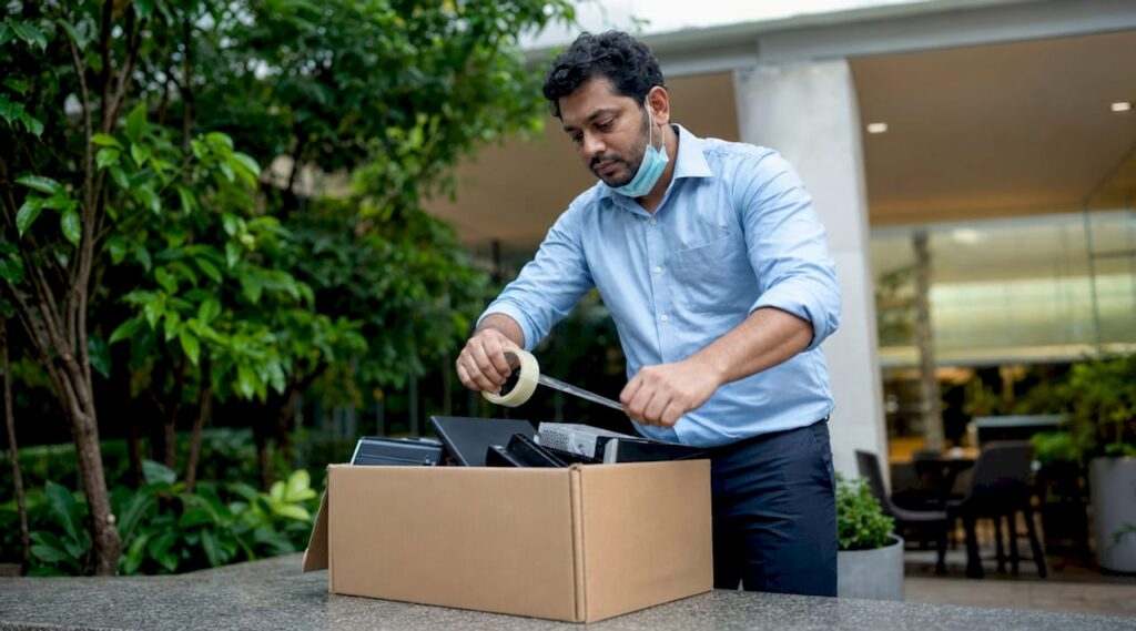 IT manager packing IT assets for recycling